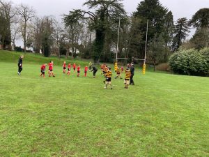 Kids playing rugby at Inchmarlo sports field in Scotland, outdoor sports activity.