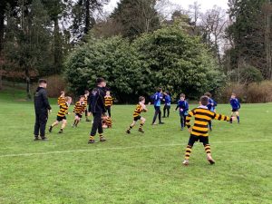 Children playing football at Inchmarlo outdoor sports field.
