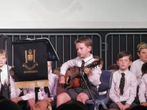 Children performing musical recital at Inchmarlo School, Scotland.