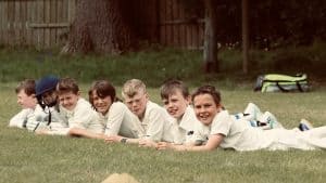 Children playing outdoors at Inchmarlo School in a lush garden setting.