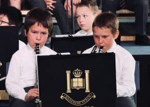 Children performing musical instruments at Inchmarlo, highlighting youth activities and musical events.