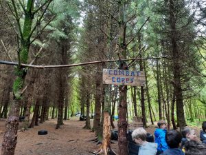 People enjoying outdoor activity in wooded park at Inchmarlo.