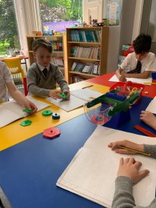 Children engaged in classroom activities at Inchmarlo, a leading educational institution in Scotland.