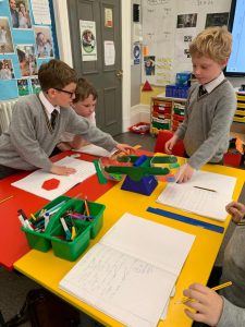 Students engaged in classroom activity at Inchmarlo educational center.
