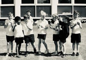 Group of children enjoying outdoor activities at Inchmarlo School.