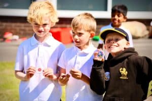 Children enjoying outdoor activities at Inchmarlo School, showcasing a vibrant learning environment.