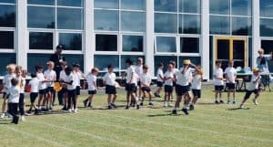 Students playing outside at Inchmarlo School, emphasizing outdoor activities and education.