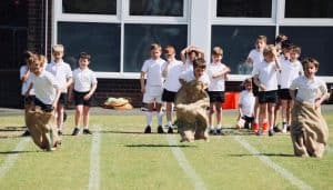 Children engaging in outdoor educational activities at Inchmarlo School.