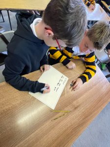 Children collaborating on a project at Inchmarlo School, engaging in creative learning activities.