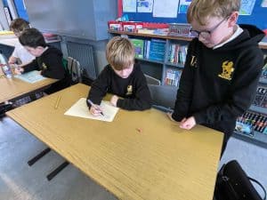 Students working on assignments at Inchmarlo School for quality education.