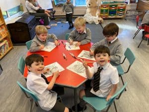 Children engaging in arts and crafts at Inchmarlo nursery, promoting creativity and learning.
