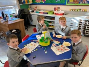 Children enjoying lunchtime at Inchmarlo school classroom.