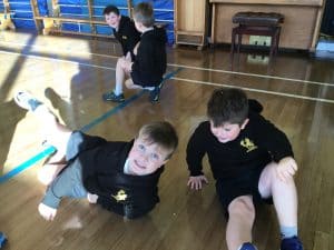Children playing and exercising at Inchmarlo school indoor gym.