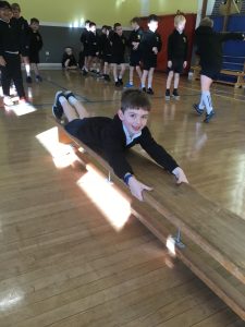 Students participating in indoor physical activities at Inchmarlo school.