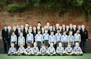 Group of happy school children in uniform outdoors at Inchmarlo School, Aberdeen.