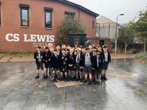 Group of children in school uniforms standing outside Inchmarlo, a renowned Scottish educational institution.