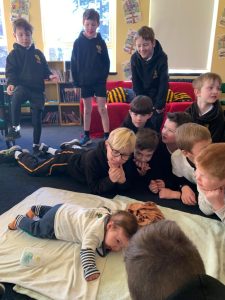 Children engaging in interactive learning activity at Inchmarlo school.