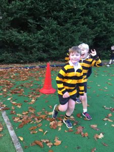 Children playing outdoor sports at Inchmarlo estate, enjoying fresh air and activity.