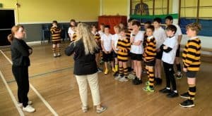 Group of children in rugby uniforms during Inchmarlo sports event.